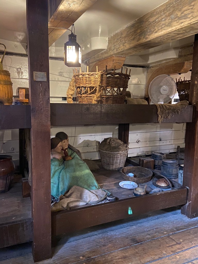 In steerage, below deck, bunk beds.